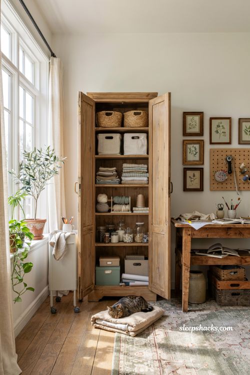 Craft room ideas with vintage furniture hidden storage and organized creative workspace