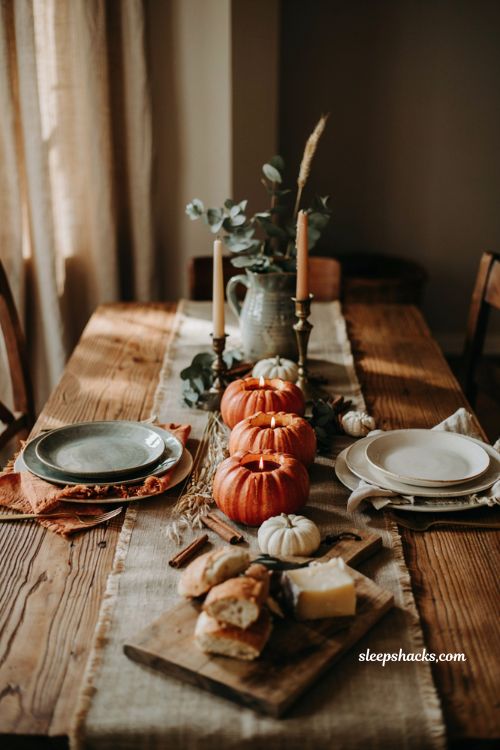 DIY mini pumpkin beeswax candle trio centerpiece on a cozy farmhouse dining table for fall decor
