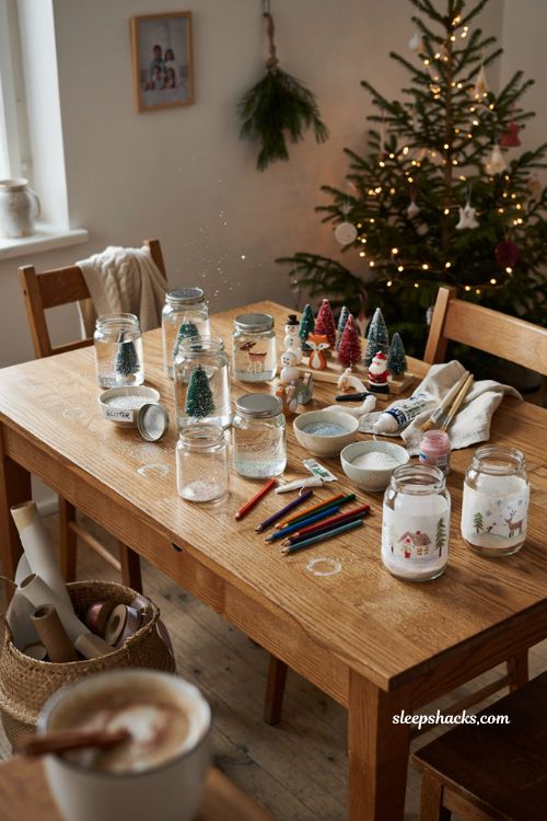 DIY snowglobes Christmas craft for kids with jars glitter and miniature trees
