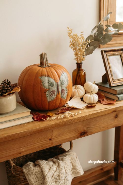 Decorate pumpkin ideas with baby's first handprint pumpkin for sentimental fall family decor