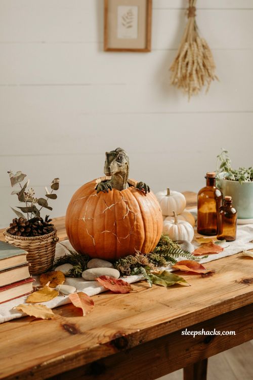 Decorate pumpkin ideas with dinosaur hatching pumpkin for fun family fall decor