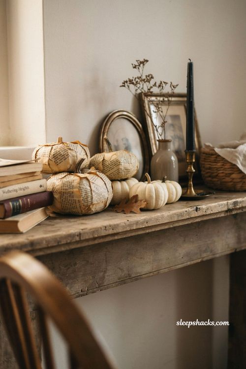 Decoupage pumpkins with old book pages for farmhouse Halloween decor 