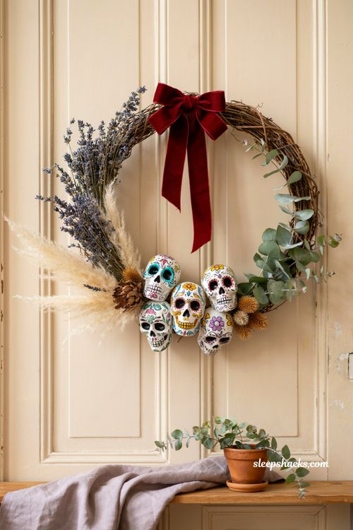 Día de los muertos skull wreath with dried lavender eucalyptus pampas grass and colorful sugar skulls