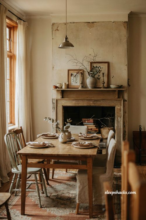 Dining room decoration ideas with styled unused fireplace
