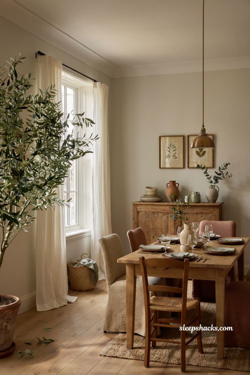 Dining room decoration ideas with tall potted tree and greenery