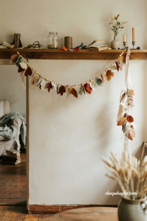 Diy fall garland ideas with felt leaves book pages wood beads and rustic mantel decor