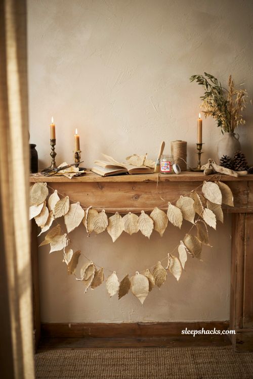 Diy old book page leaf garland with vintage paper leaves and jute twine for fall decor