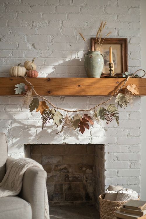 Dollar Tree fall garland with faux leaves dried botanicals pumpkins and cozy farmhouse mantel decor 
