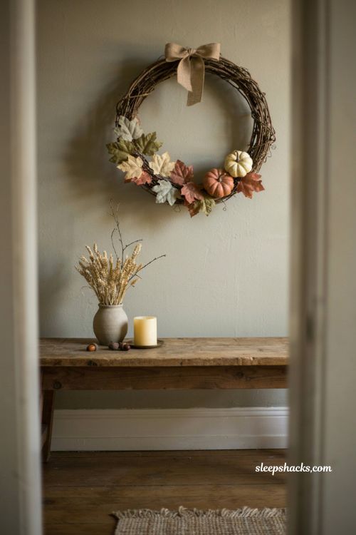 Dollar Tree grapevine wreath fall decor with faux leaves mini pumpkins and burlap ribbon 