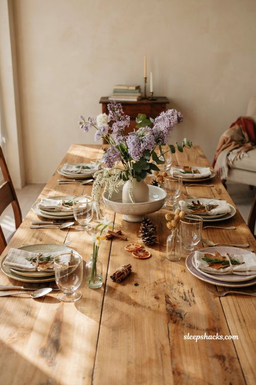Dramatic overflowing lilac centerpiece idea for a fall baby shower with tiered vase and bowl technique