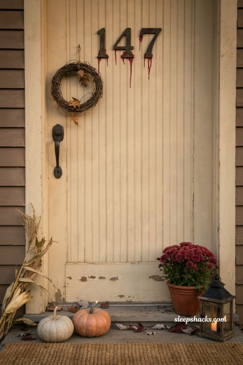 Dripping blood house numbers on a farmhouse Halloween front door