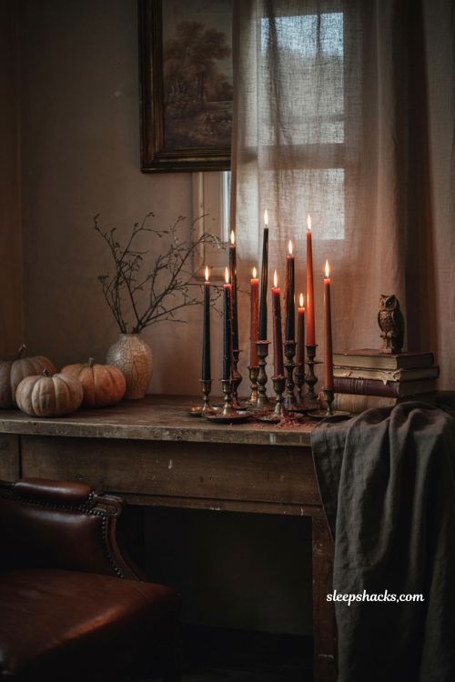 Drippy black and orange taper candles for gothic Halloween room decor