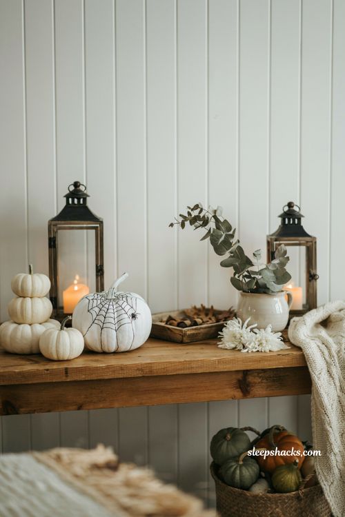 Easy painted pumpkin ideas with a white spiderweb pumpkin for family friendly Halloween decor