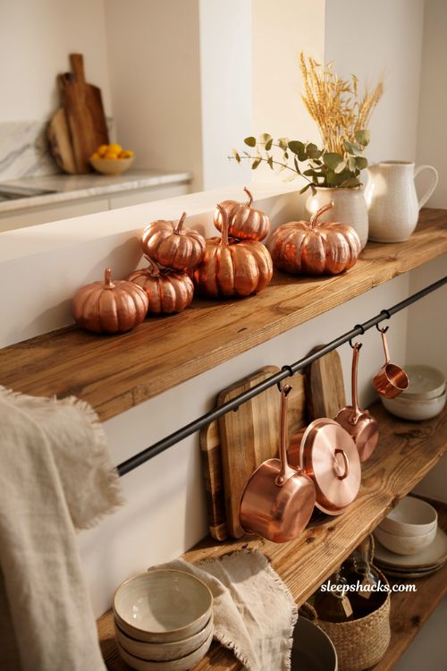 Easy painted pumpkin ideas with copper metallic pumpkins for cozy fall kitchen decor