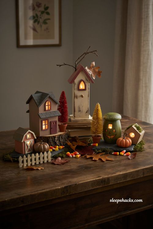 Fairy light filled birdhouse Halloween village with cozy fall accents 