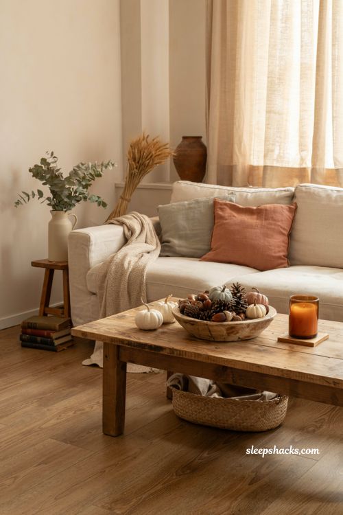 Fall bowl centerpiece ideas with acorns pinecones and cozy farmhouse decor
