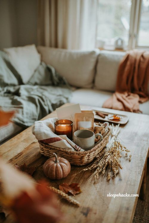 Fall care package basket with cozy candle snacks mug blanket and thoughtful gifts
