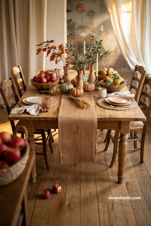 Fall centerpiece with wood plank runner apples pears and rustic table decor