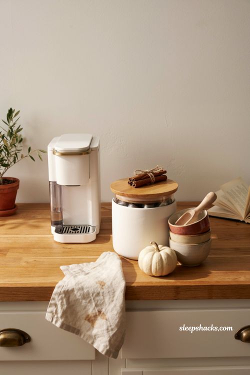 Fall coffee station ideas with pretty pod storage glass jar pumpkin and cinnamon