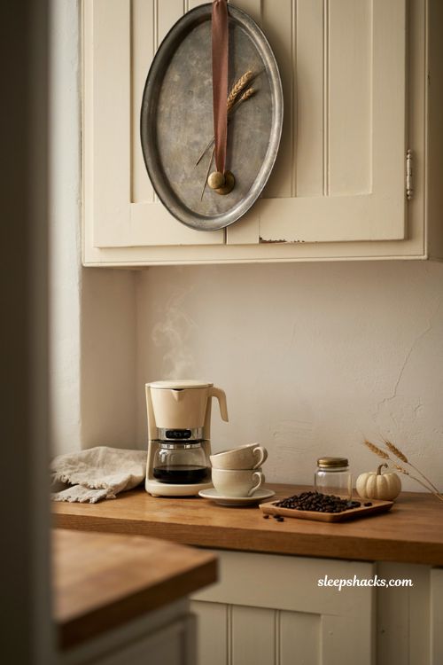Fall coffee station ideas with vintage tray cabinet decor and small kitchen styling