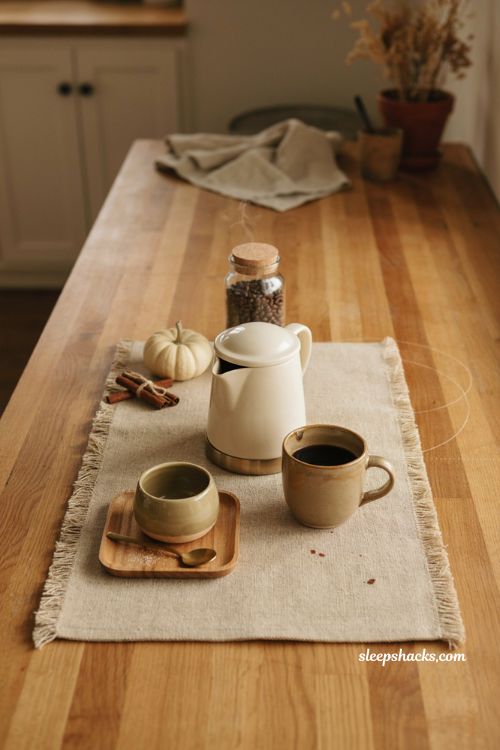 Fall coffee station ideas with woven coffee mat cozy mugs and warm autumn accents