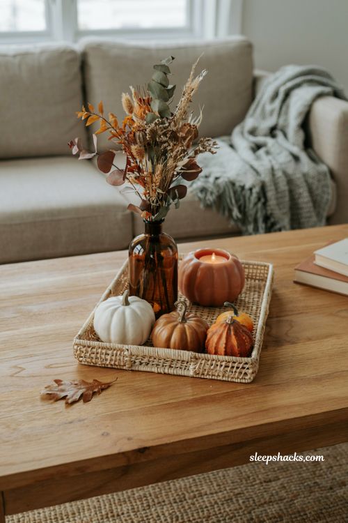 Fall coffee table decor tray with glowing pumpkin candle and cozy autumn accents
