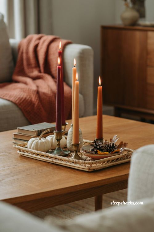 Fall coffee table decor with taper candles burgundy amber and autumn accents 