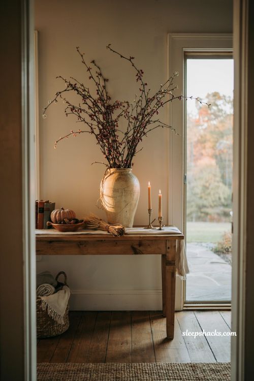 Fall decor on a budget using dried yard branches in a cozy farmhouse entryway