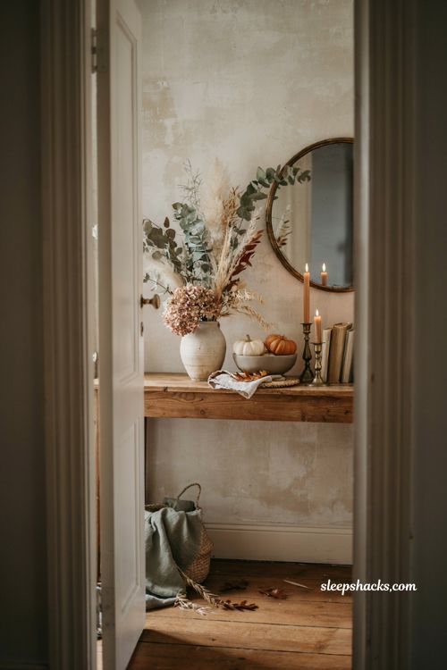 Fall entryway table decor with dried florals eucalyptus pampas grass and pumpkins
