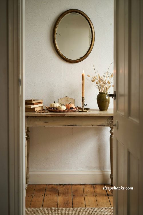 Fall entryway table decor with layered tray pumpkins candle and rustic seasonal accents