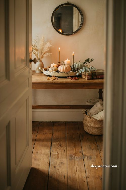Fall entryway table decor with textured tray candles mini pumpkins and acorns