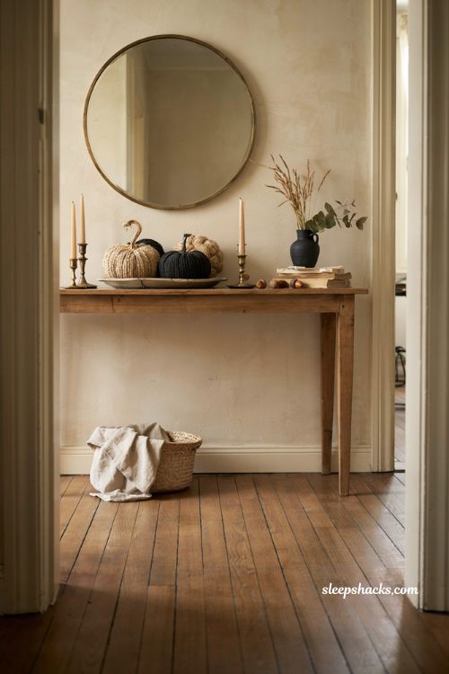 Fall entryway table decor with woven pumpkins black neutral tones and cozy accents