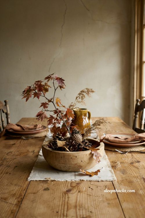 Fall leaves decor in a rustic wooden dough bowl centerpiece