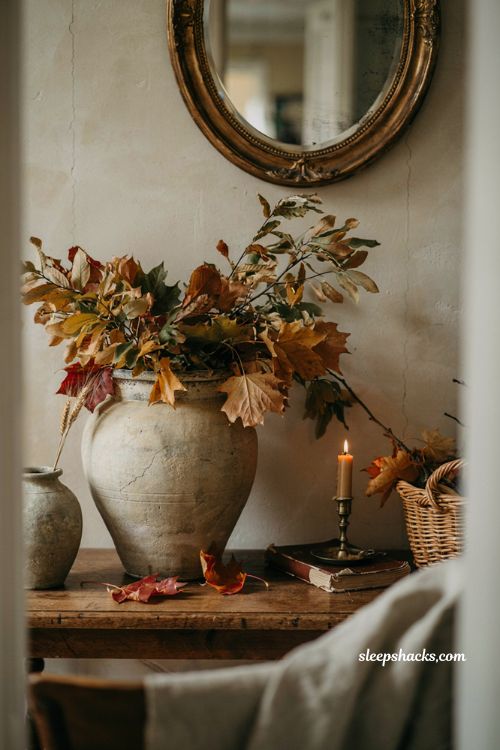 Fall leaves decor overflowing from a thrifted vintage urn
