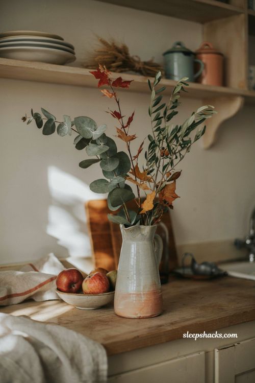 Fall leaves decor with eucalyptus branches in a vintage vase