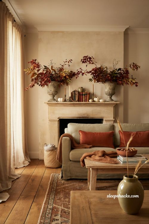 Fall mantel with oversized foliage vases and natural autumn branches