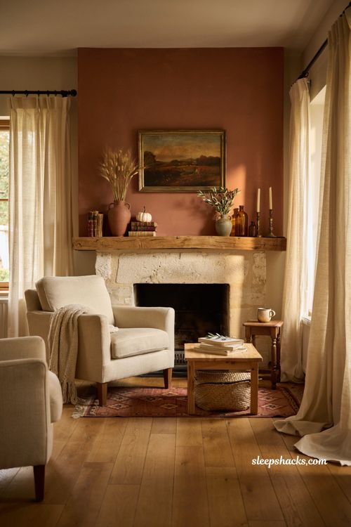 Fall mantel with terracotta accent wall and warm autumn fireplace decor