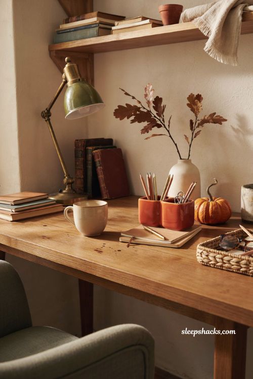 Fall office decor with orange desk organizer cozy mug and autumn accessories
