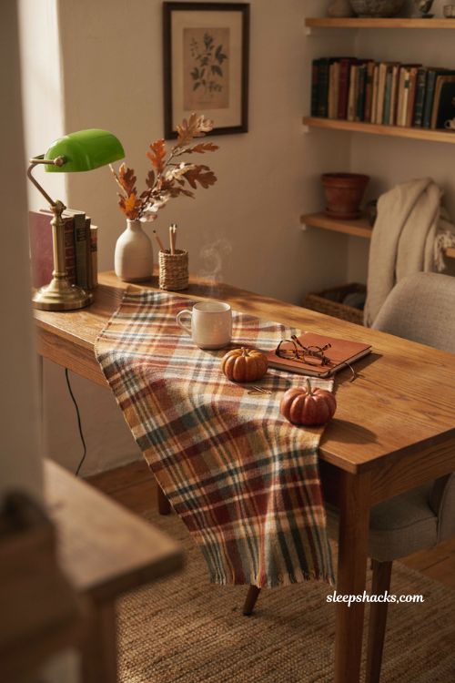 Fall office decor with plaid fabric desk runner pumpkins mug and cozy autumn accents