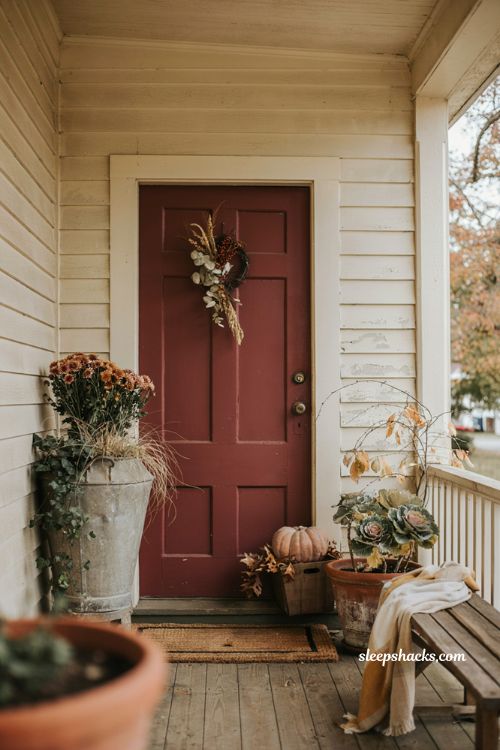 Fall planters for front porches with mums pumpkins and rustic containers 