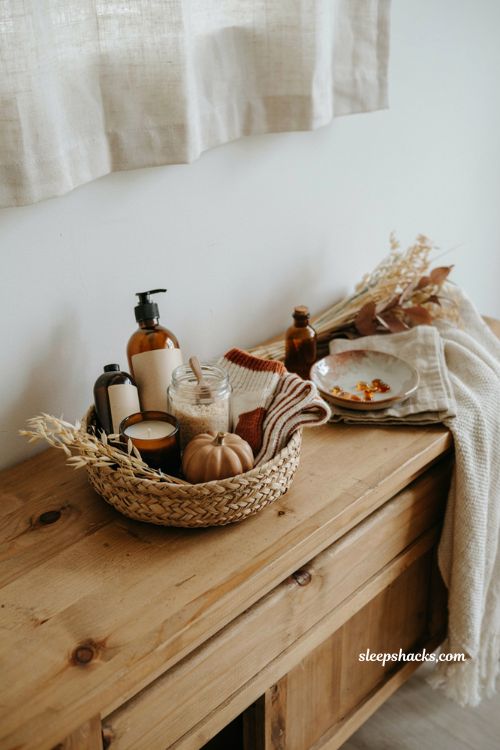 Fall self care basket with lotion bath soak cozy socks candle and autumn gifts