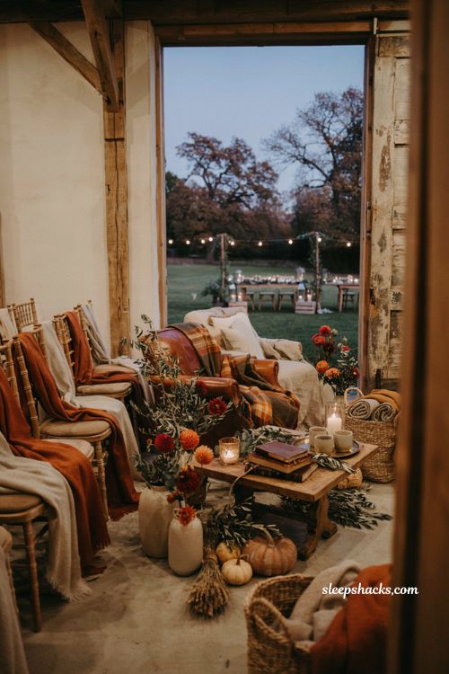 Fall wedding ideas with cozy blanket station and rustic outdoor lounge seating