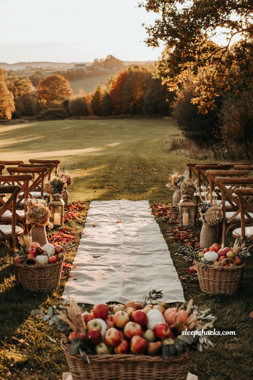 Fall wedding ideas with harvest aisle decor using apples pumpkins and wicker baskets