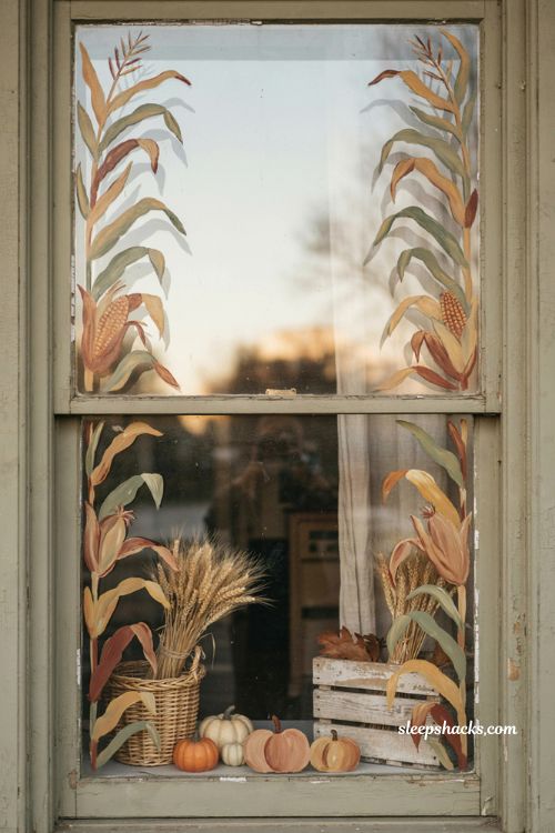 Fall window painting with corn stalk border pumpkins golden leaves and rustic harvest decor