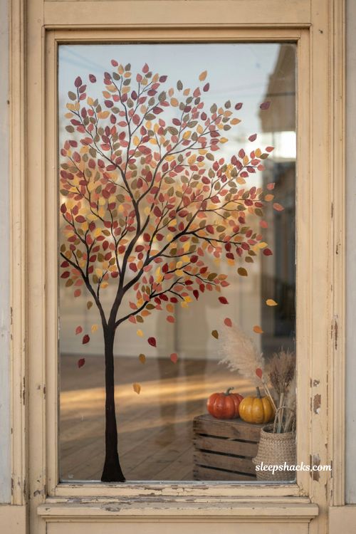 Fall window painting with silhouette tree colorful autumn leaves and storefront decor