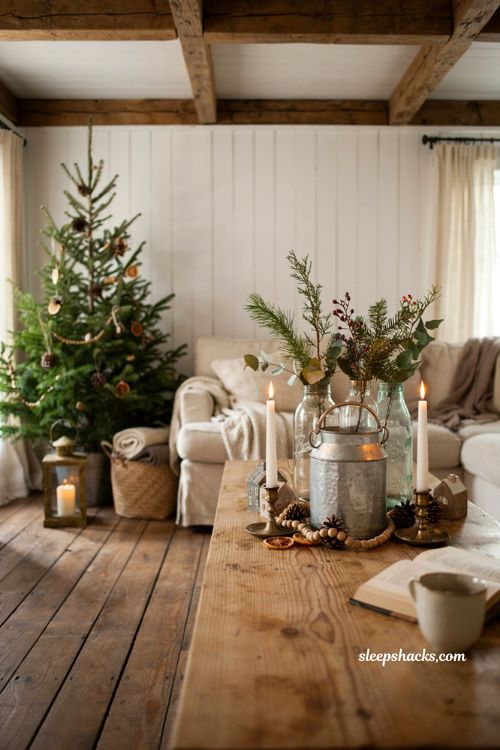 Farmhouse christmas decor with vintage mason jars filled with fresh holiday greenery