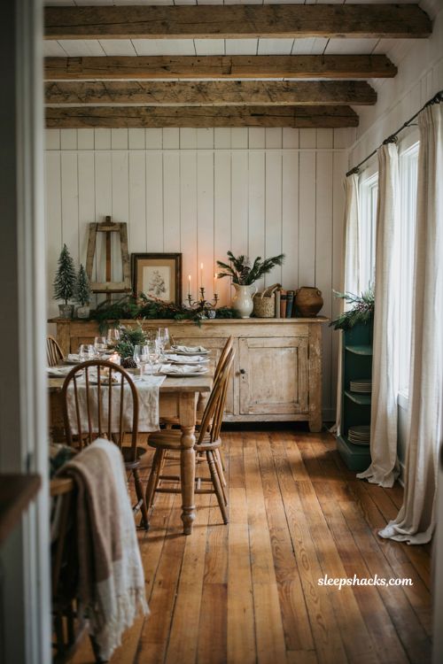 Farmhouse christmas dining room with a reclaimed wooden sign and cozy buffet decor