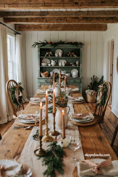 Farmhouse christmas dining room with layered burlap bows and rustic holiday table decor