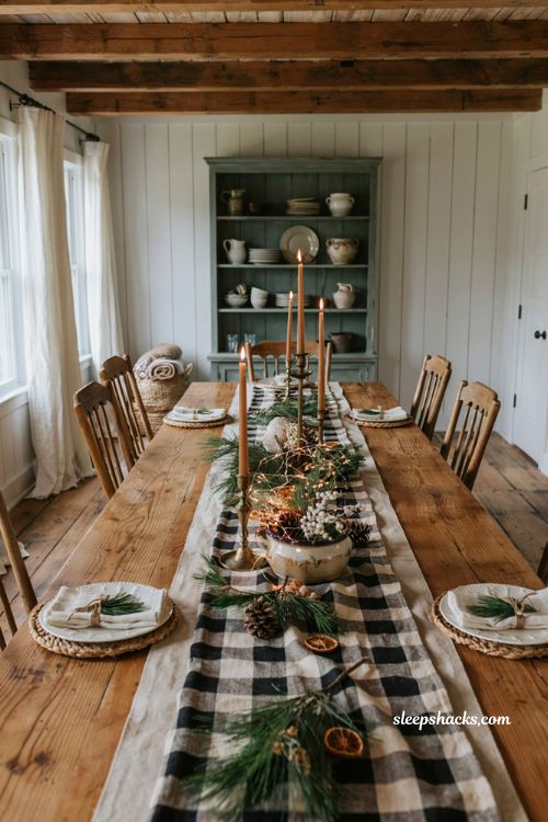 Farmhouse christmas dining table with a layered buffalo check and linen table runner