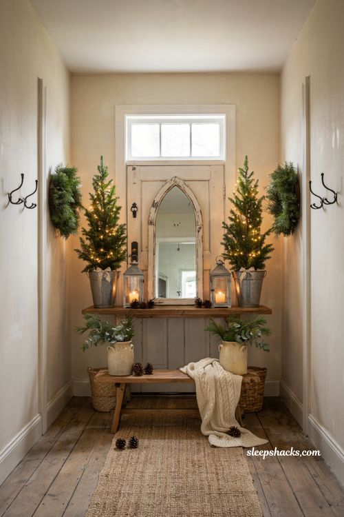 Farmhouse christmas entryway decor with matching wreaths and mini trees for symmetry